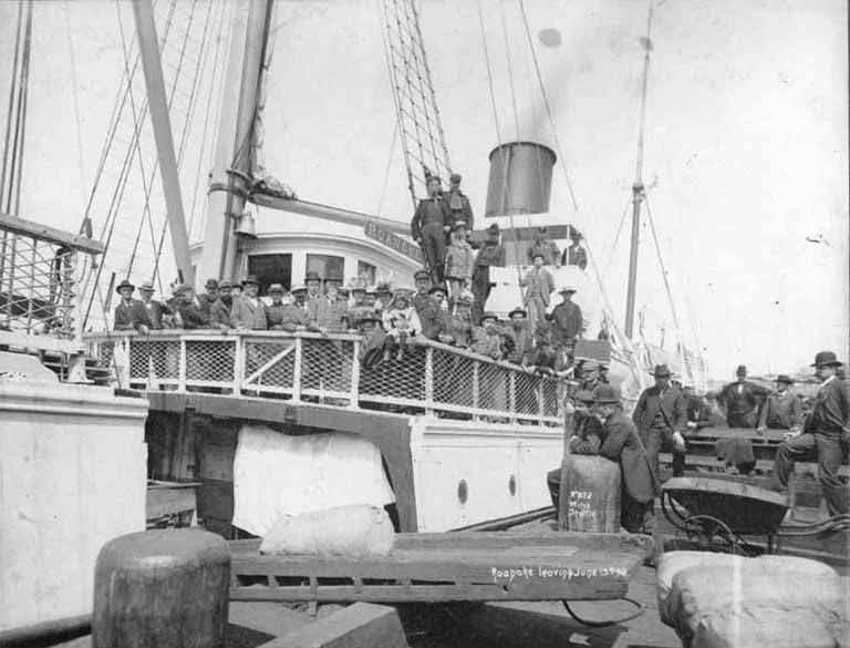 Passengers aboard the steamer Roanoke leaving for the Klondike from a Seattle dock, June, 1898