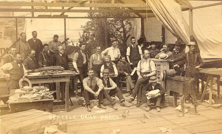 Seattle Daily Press newspaper staff and equipment housed in temporary tent after the fire of June 6, 1889, Seattle.