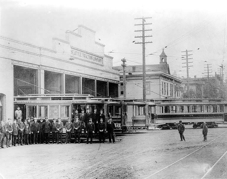 Seattle Traction Company car barn at 5th Ave. and Olive St. showing staff and streetcars, 1898