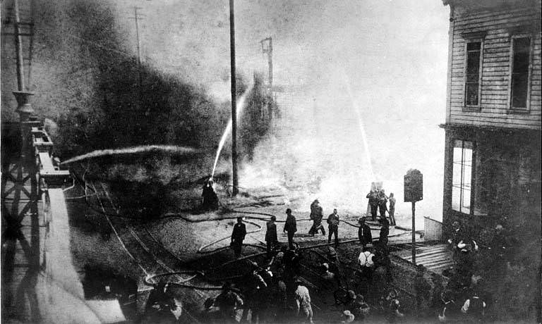 Start of the fire of June 6, 1889, looking south on 1st Ave. near Madison St.