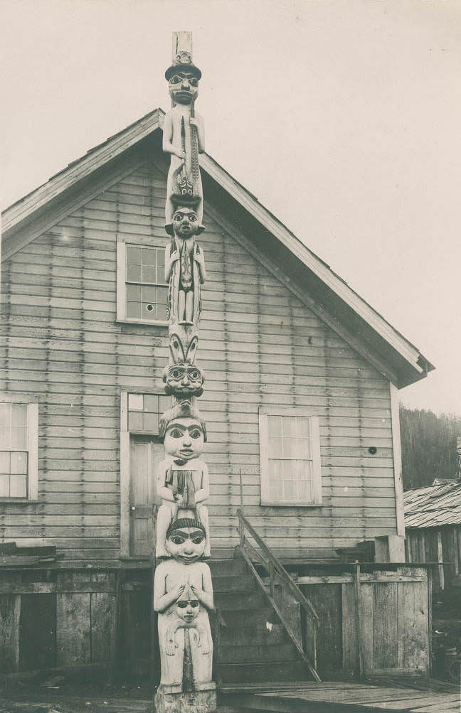 Beaver totem pole in front of home in Wrangell, Alaska, 1899