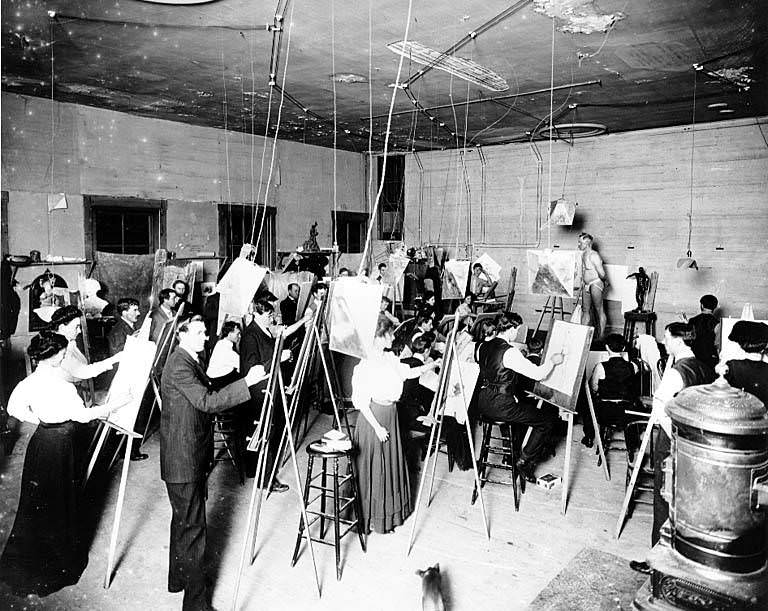 Art studio interior showing men and women painting, 1890s