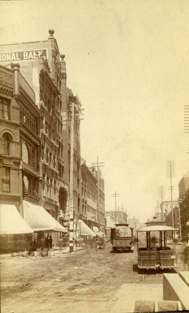 View of reconstruction following fire from 1st Ave. and James Street, July 1890