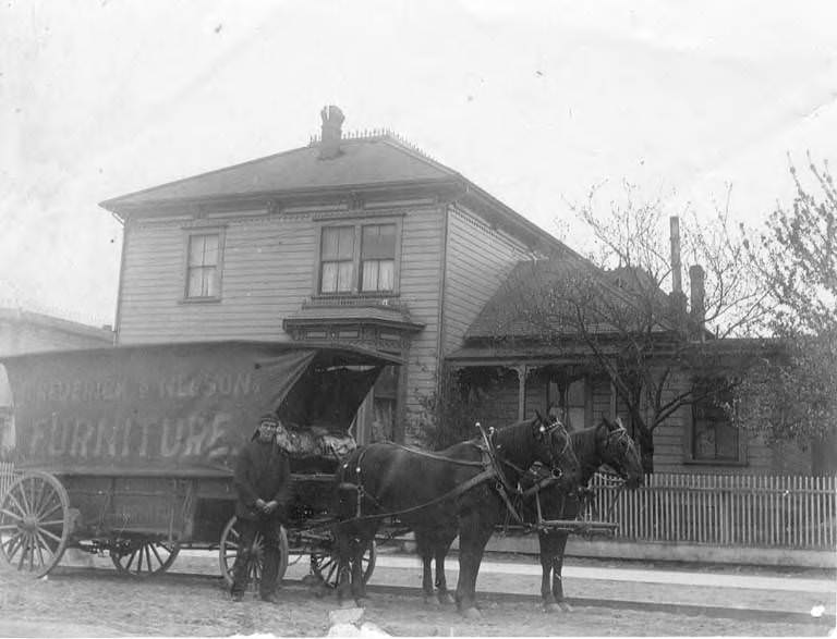 David Judkins' house with John Roby Judkins standing in front of Frederick & Nelson furniture wagon, Seattle, 1879