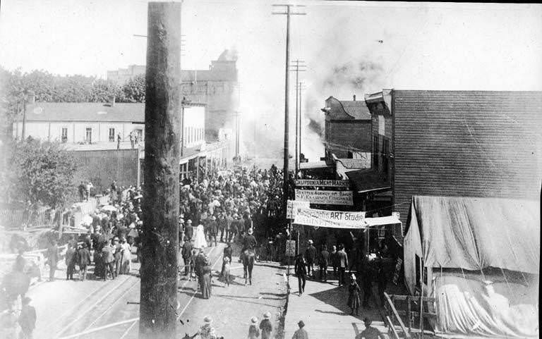 Fire of June 6, 1889 looking south along 1st Ave. from Spring St. showing the beginning of the fire