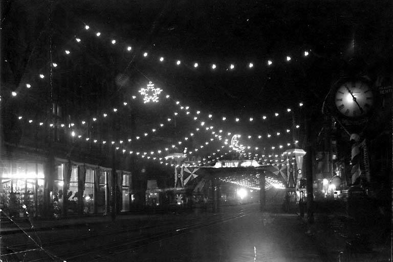 1st Ave. decorated at night, 1899