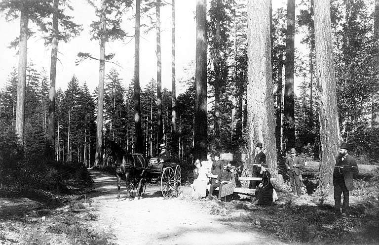 Guy C. Phinney with group in Woodland Park on road to Green lake, Seattle, 1893