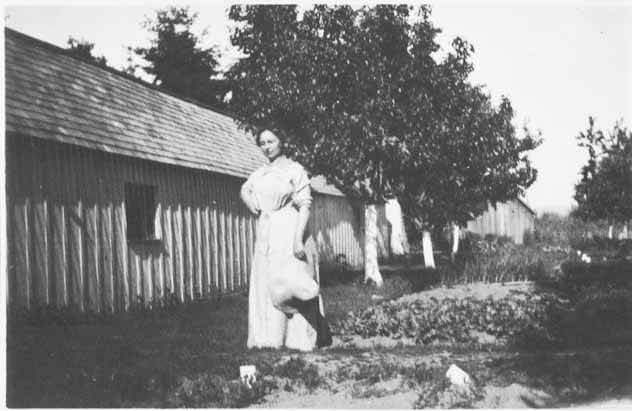 Grace Hill outside chicken coop, Bellevue, 1912