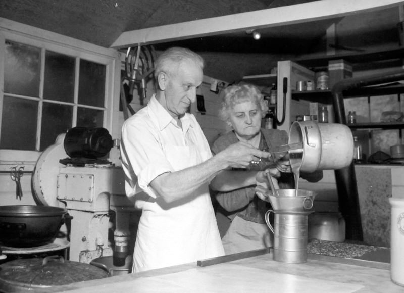 Mr. And Mrs. Benjamin Johnson making candy at their Bellevue Kandy Kottage, which was at 1910 104th N.E., 1950s