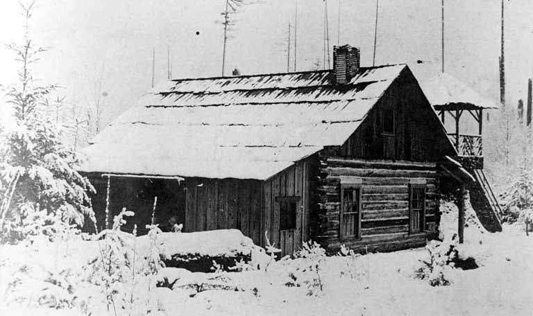Log cabin in the snow, Bellevue, Washington,1905