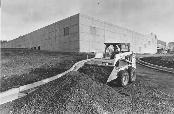 Skid-steer loader clearing grounds for new Microsoft plant, Bothell, December 30, 1987