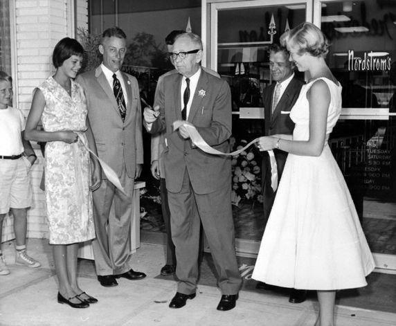 Nordstrom founder John W. Nordstrom cuts the ribbon at the 1958 grand opening of the Bel-Square 'Nordstom's'.