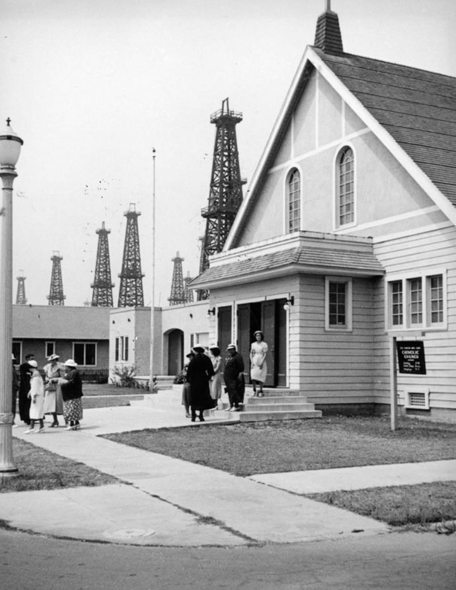 Oil derricks loom behind St. Mary’s by the Sea Catholic Church in Huntington Beach, 1937