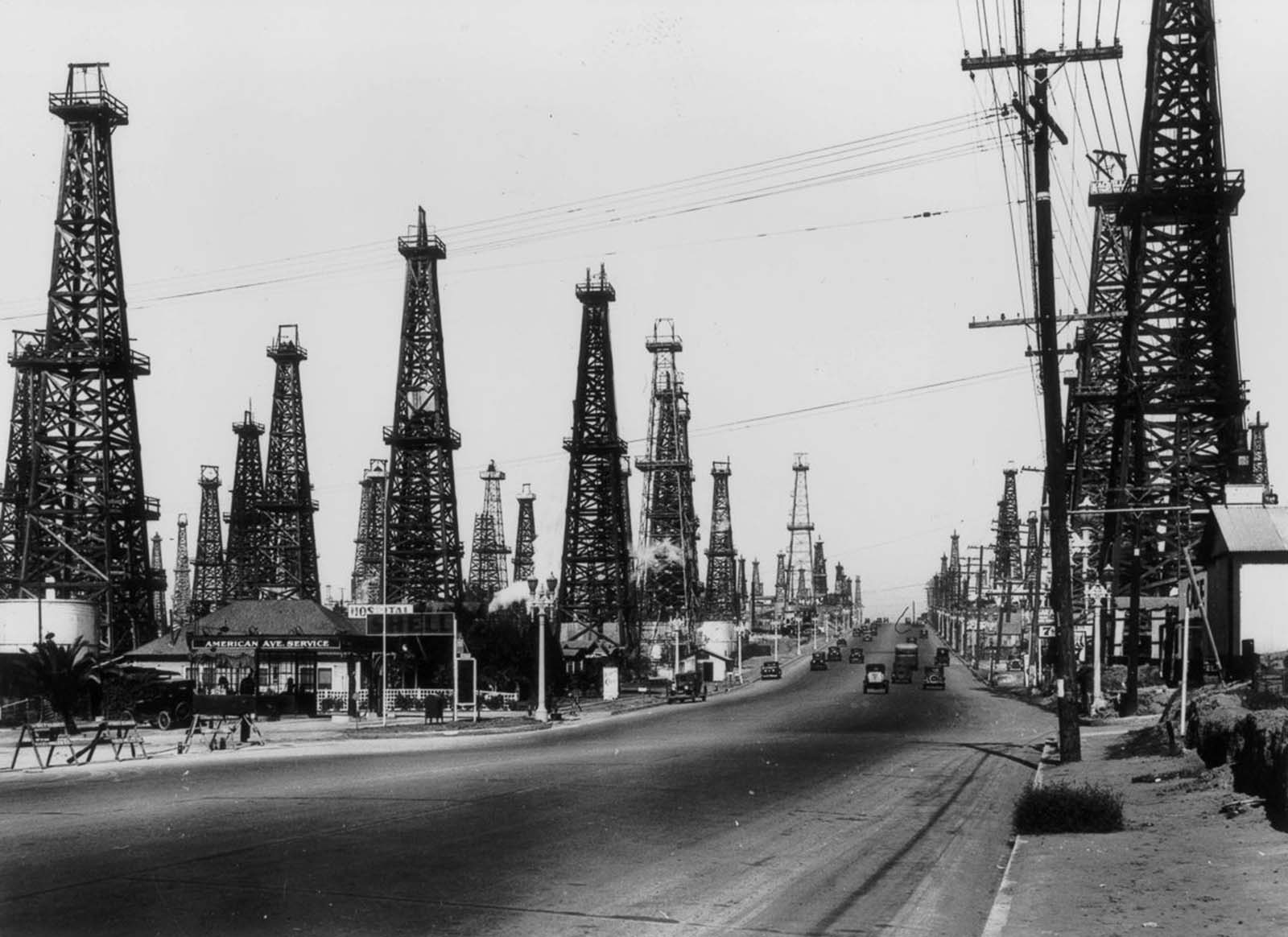 Oil derricks line a road outside Los Angeles, 1930