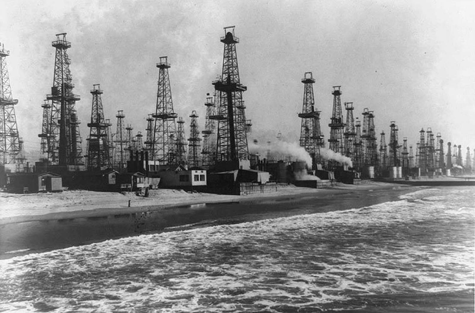 Oil wells in Venice, California, bringing oil up from beach area in 1952
