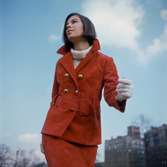 Model is wearing a red suede suit by Highlander and cashmere sweater by de Loux, 1964