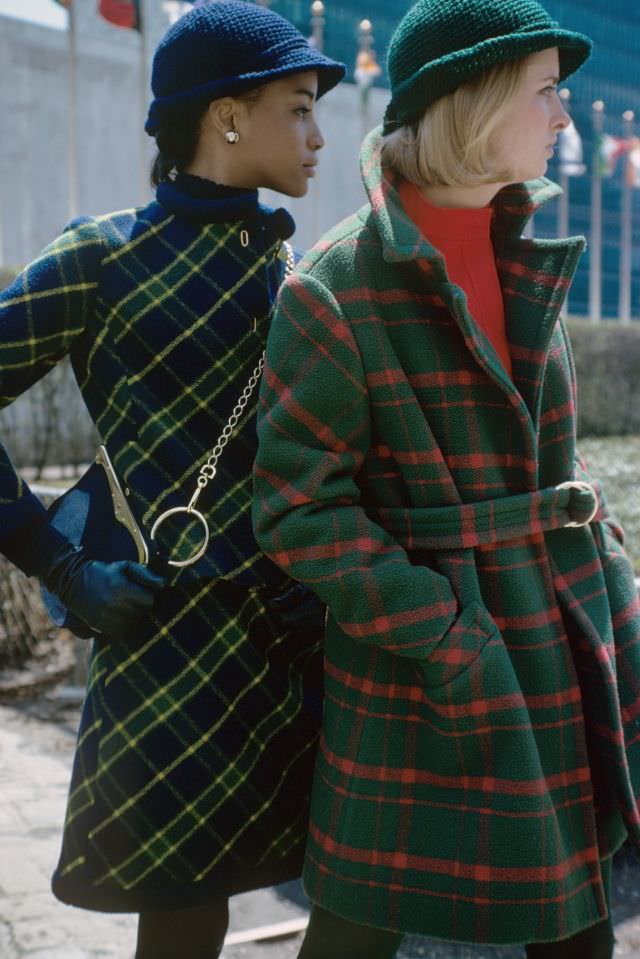 Model on the left is wearing a blue and green plaid wool suit by Louis Clausen.