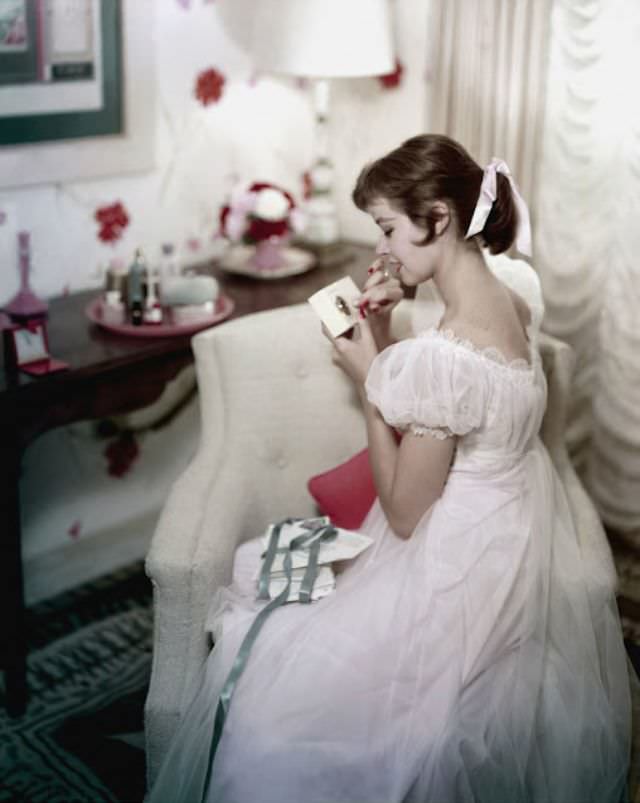 Model wearing a night gown and peignoir by Vanity Fair, 1956
