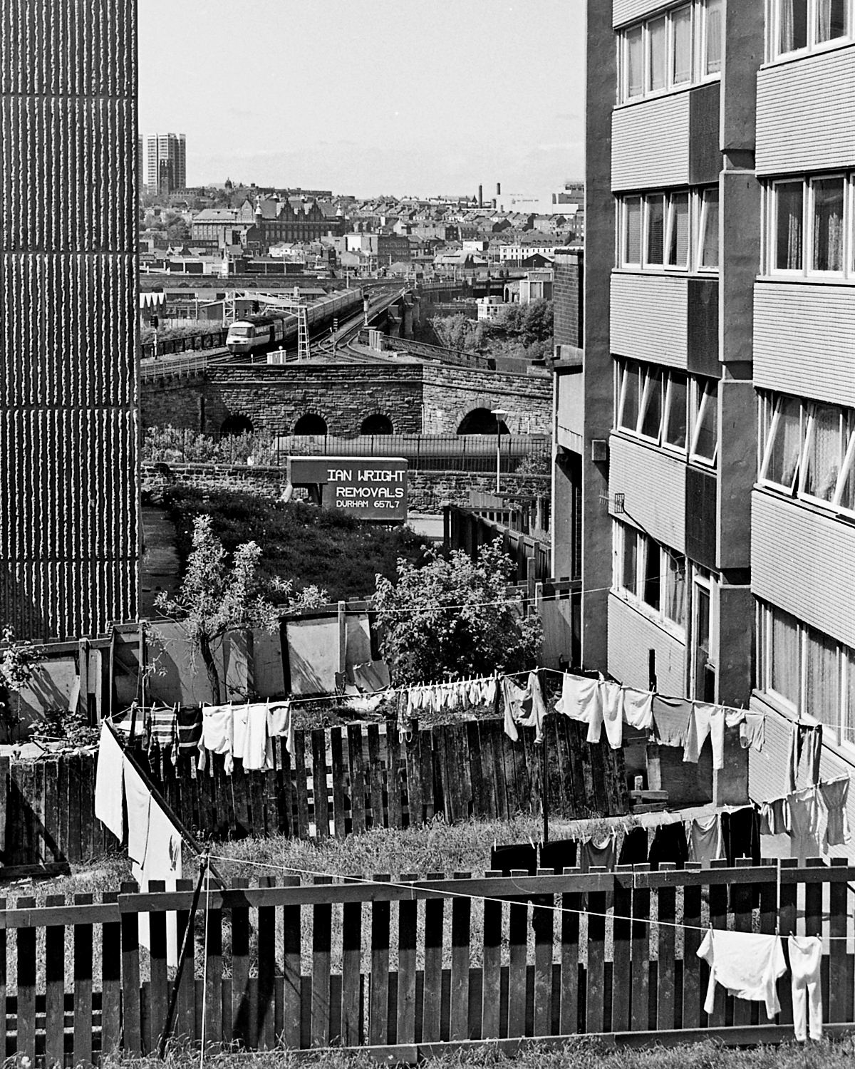 Washing day for some in St. Cuthbert’s Village in 1986 as an HST comes over the bridge from Newcastle.