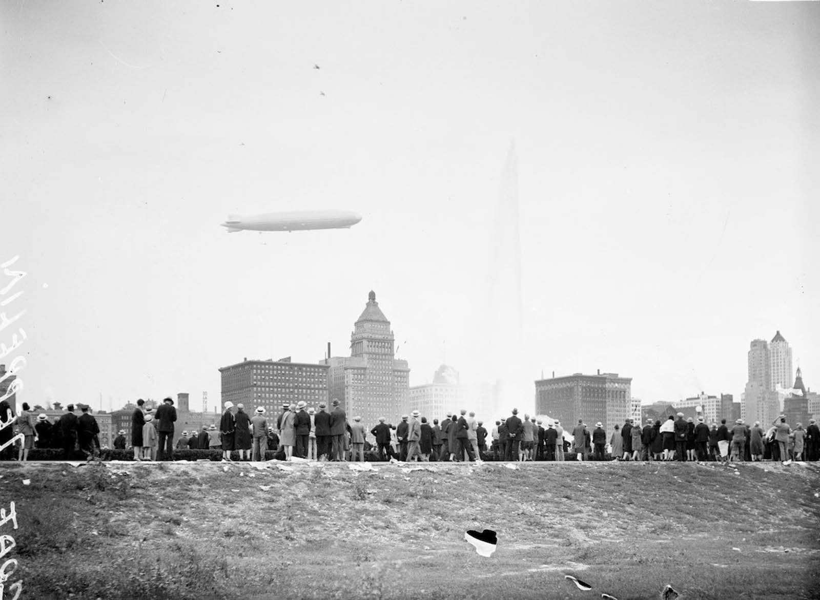 View of the Graf Zeppelin flying low over the Chicago skyline.
