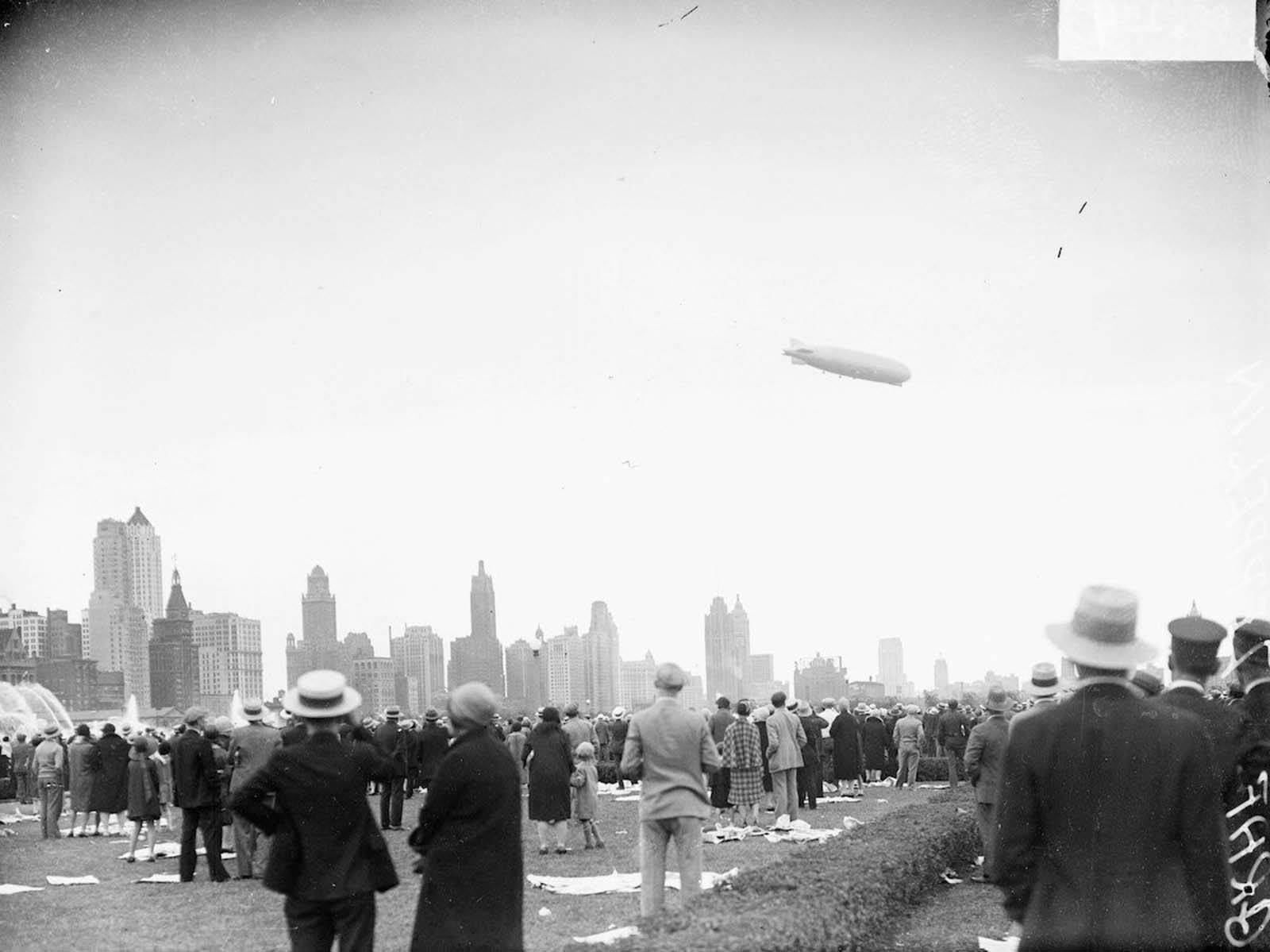 The Graf Zeppelin flying at a downward angle over Grant Park in The Loop community area of Chicago.