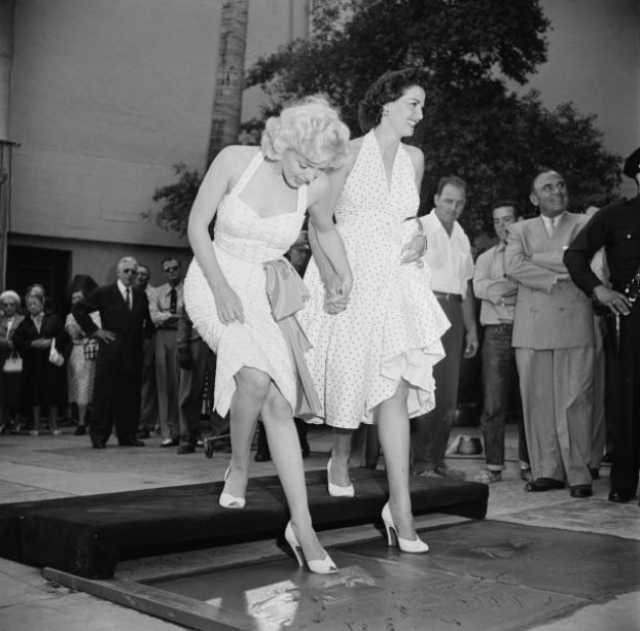 Marilyn Monroe and Jane Russell at Their Imprint Ceremony at Grauman’s Chinese Theatre in 1953