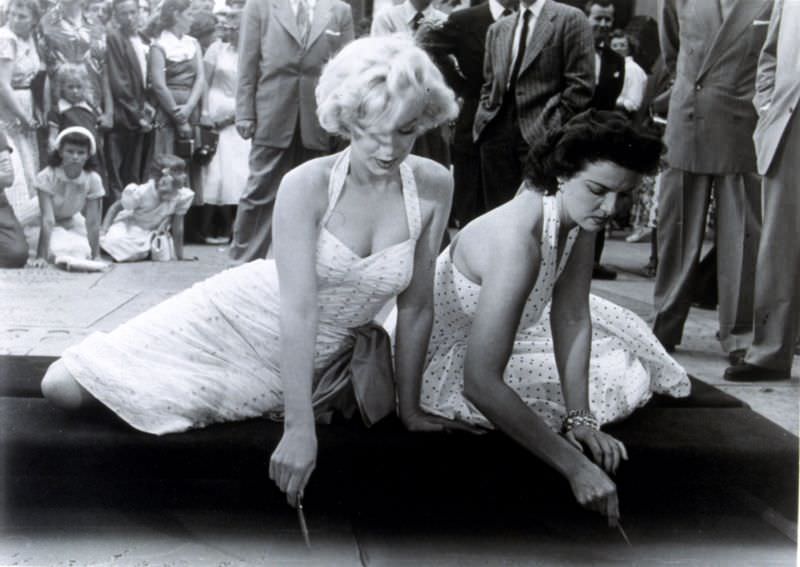 Marilyn Monroe and Jane Russell at Their Imprint Ceremony at Grauman’s Chinese Theatre in 1953