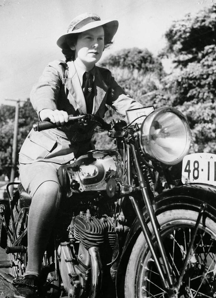 Joan Grimes, Australian Women's Emergency Legion, learns to ride a motorcycle, to fit her for the job as a dispatch rider, if needed, 1939.