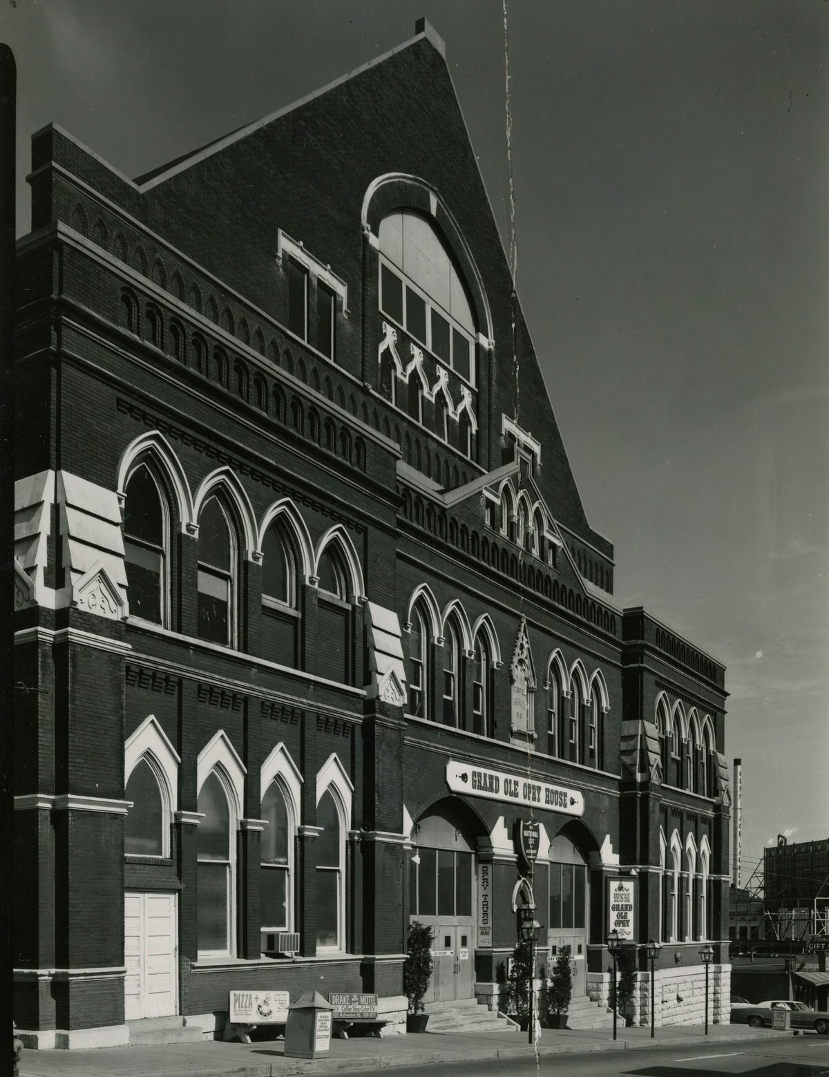 Exterior of the Ryman Auditorium showing advertisements, 1970