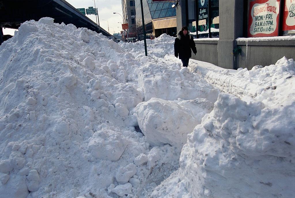 Mounds of Snow Lining City Sidewalk
