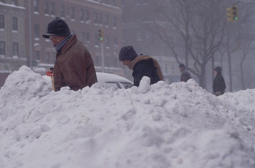 Two men shovel snow after the Blizzard of 1996.