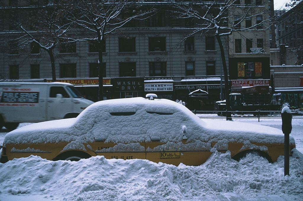 A taxi in the snow in Manhattan, New York City, during the blizzard of January 1996.