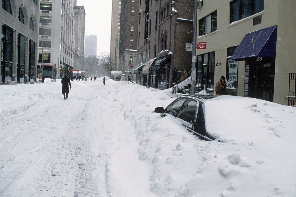 Car Parked on Street is Buried in Snow