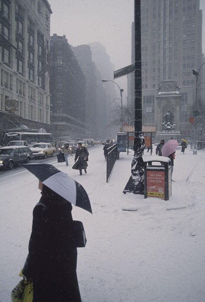 Pedestrians Carrying Umbrellas on Street During Snowstorm, New York City, 1996