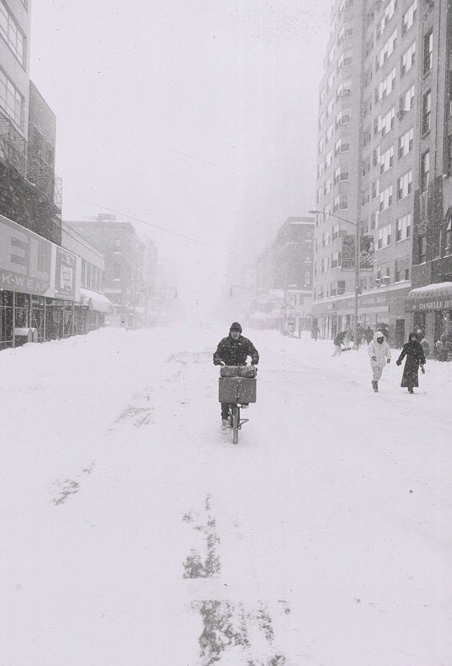 Man on Bicycle Riding in Empty, Snowy Street, New York City, 1996