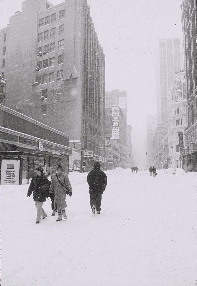 Pedestrians Walking in Empty, Snow-Covered Street, New York City, 1996