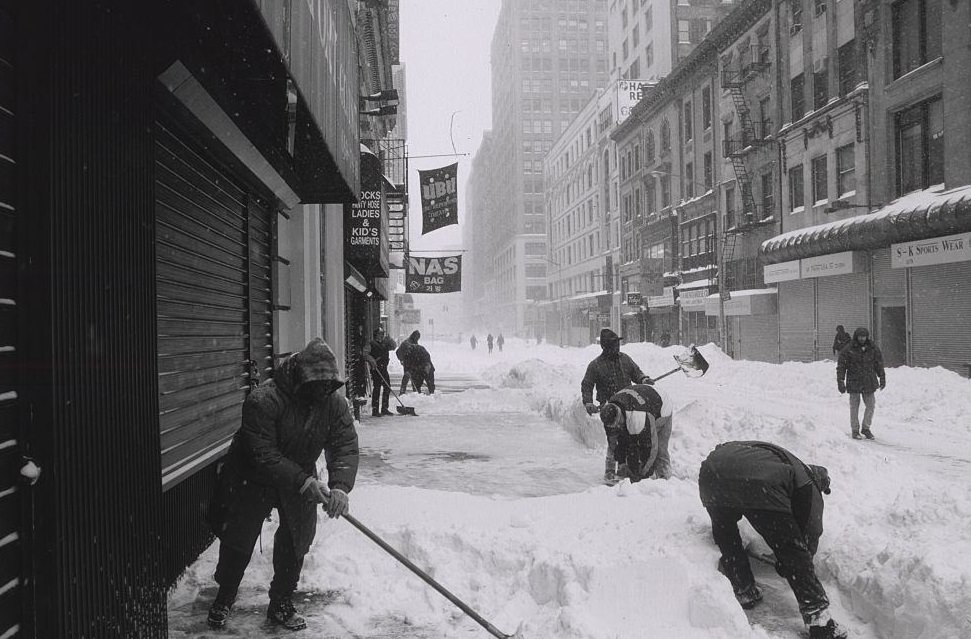 People Removing Snow from Sidewalk Using Shovels, New York City, 1996