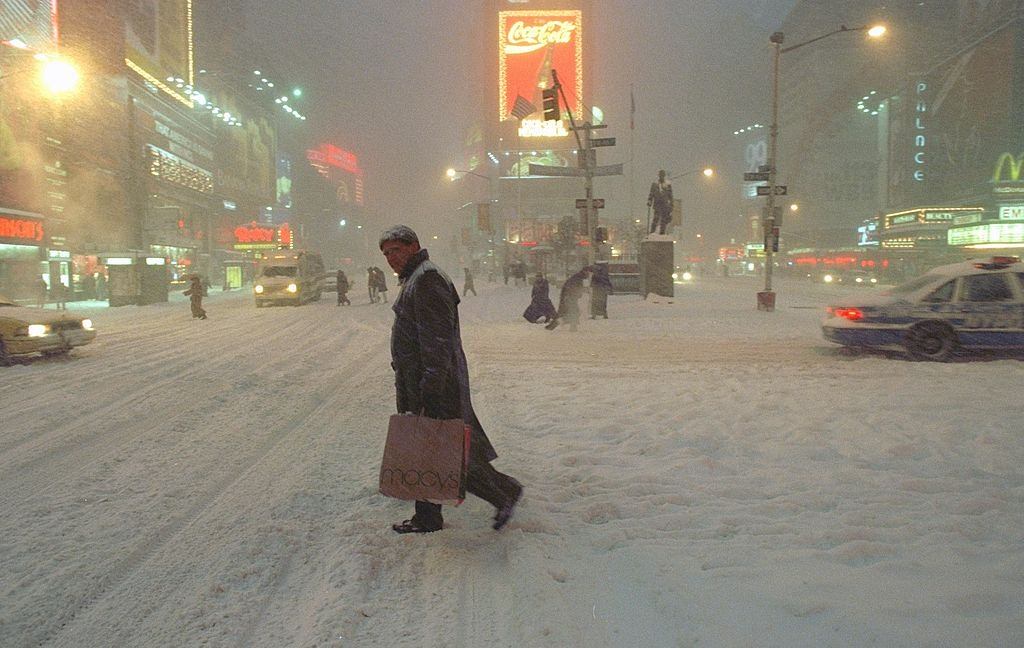 Pedestrian carefully crosses the street in Times Square during the blizzard, New York City, 1996