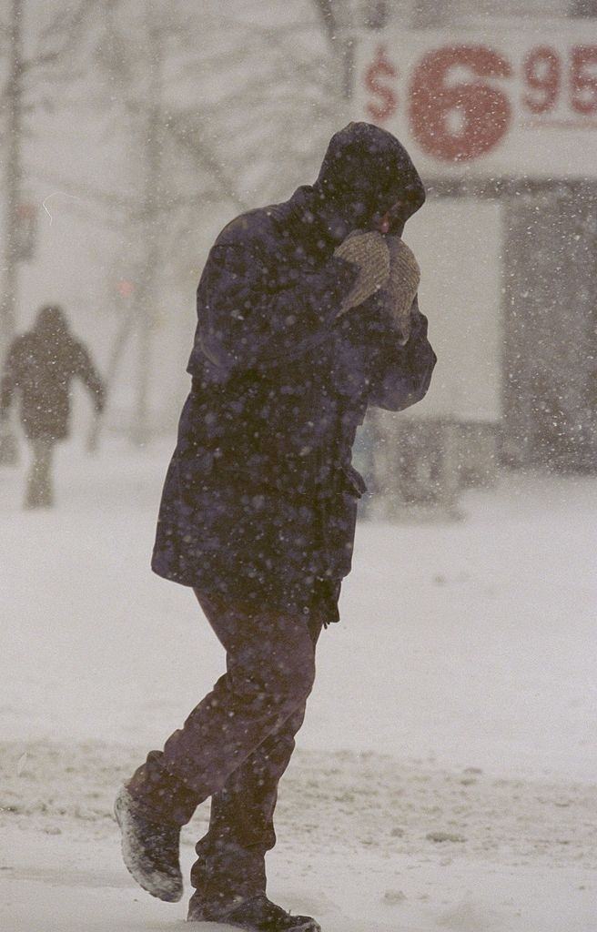 Pedestrian makes his way across W. Broadway during a blizzard, New York City, 1996