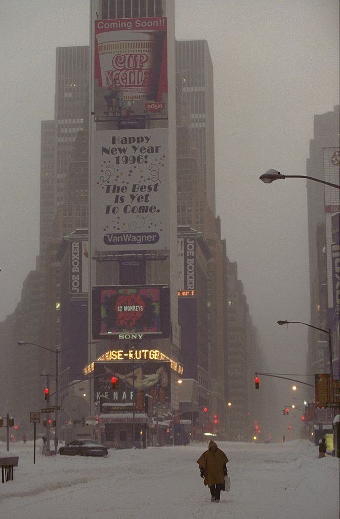 A nearly deserted Times Square during a blizzard.