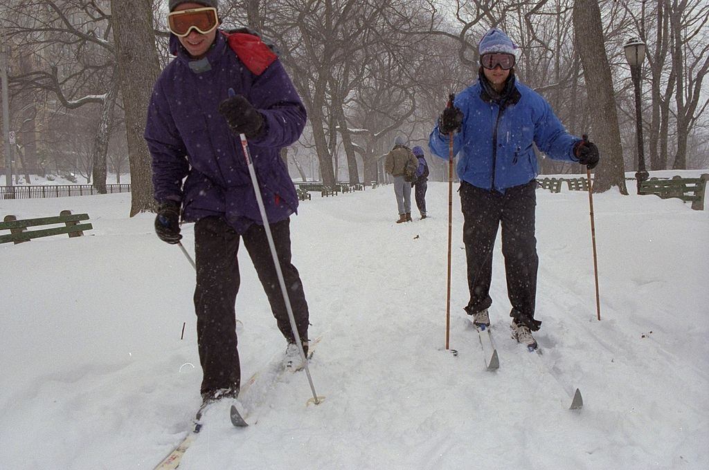 Carol Ullman and Jack Water head to work on skis on Riverside Dr. after a blizzard.