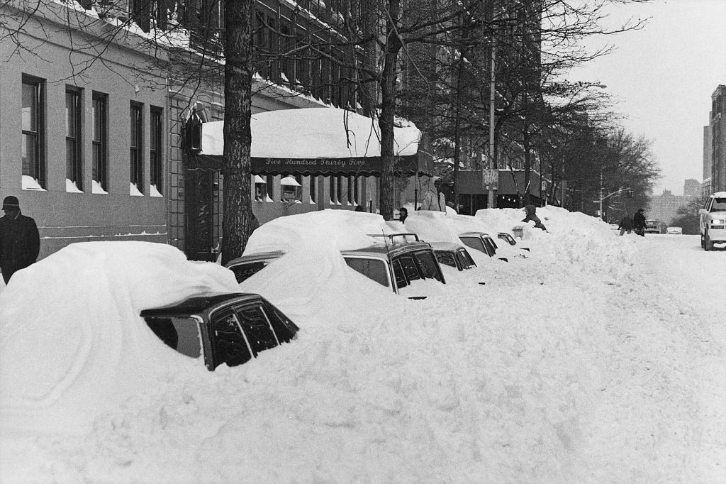 Snowdrifts covering parked cars on 110th Street after more than 20 inches (50cm) of snow fell in two days in New York City
