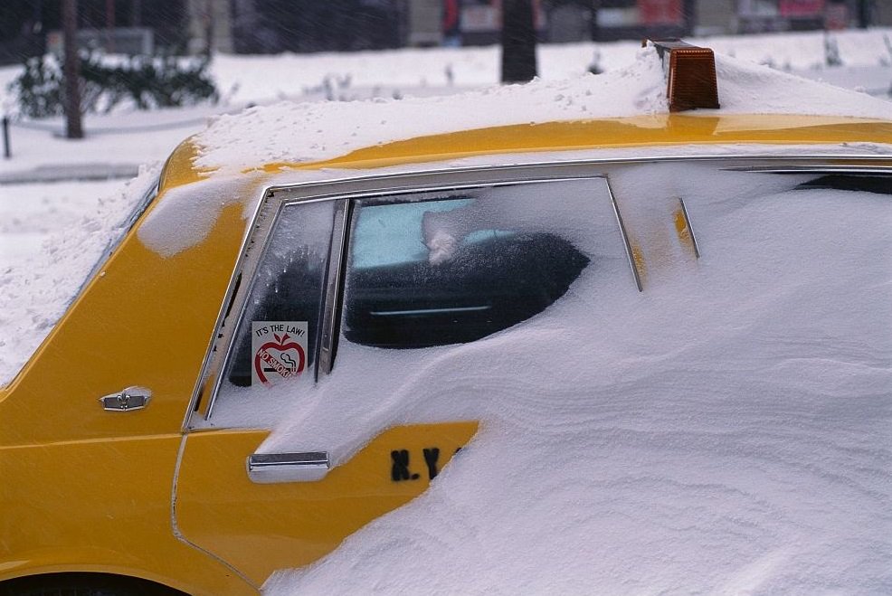 Taxi Covered with Snow