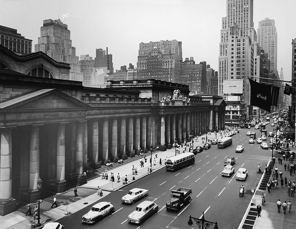 Exterior of Penn Station and traffic along Seventh Avenue, New York, New York, early 1950s.