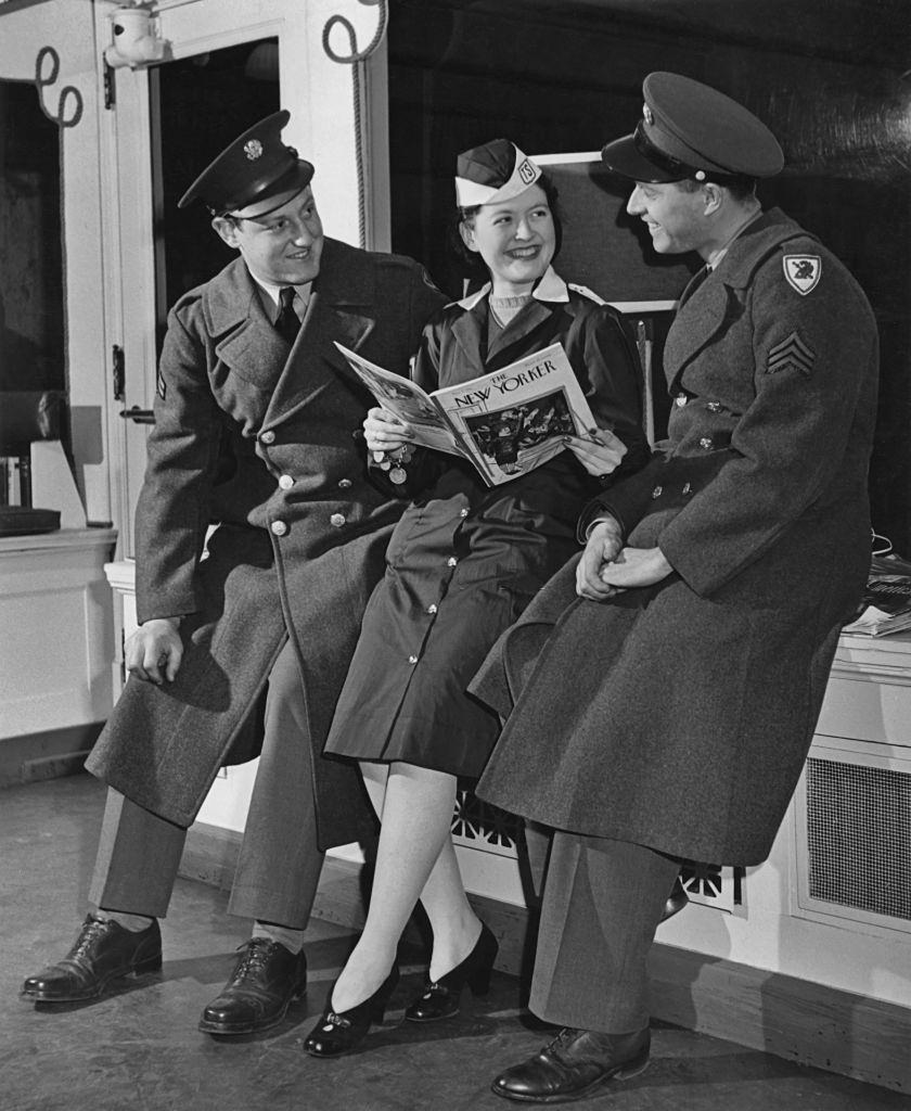 American servicemen with a smiling young woman in the canteen at Pennsylvania Station, New York City, 1943