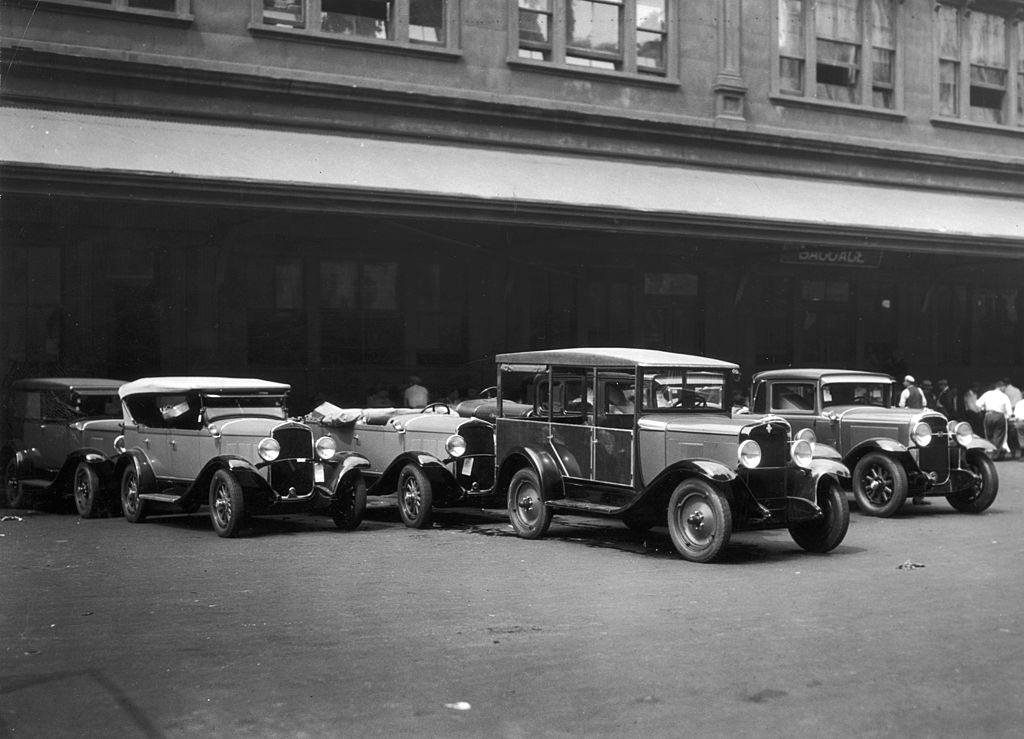 A group of cars parked outside of Pennsylvania Railroad Station, 1935