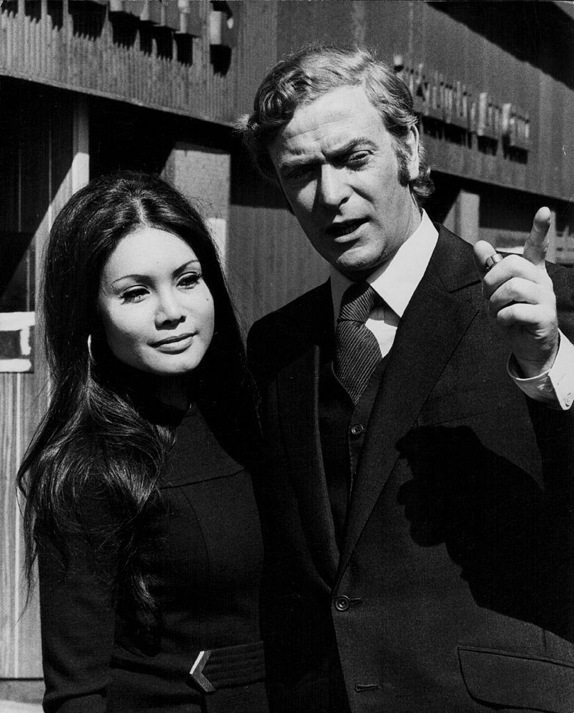 Actor Michael Caine and girlfriend Minda Feliciano on location for the film 'Get Carter', Newcastle-upon-Tyne, 1970.