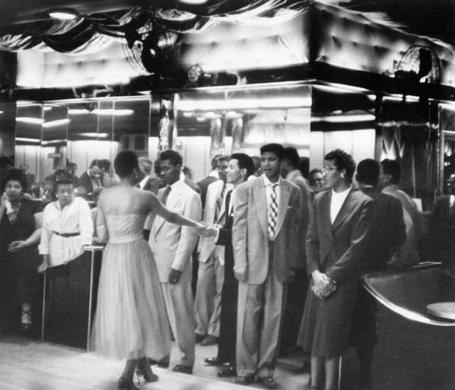 Young people waiting to enter the dance hall, 1956.