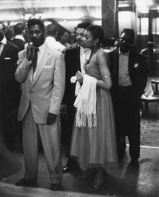 Young people waiting to enter the dance hall, 1956.