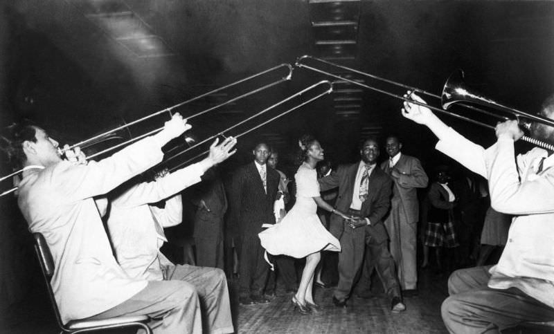 People dancing to the sound of trombones, 1947.